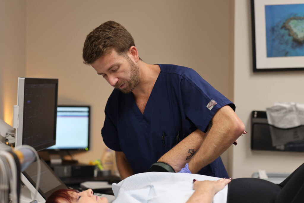 Cardiologist performing diagnostic ultrasound